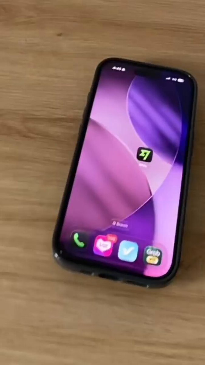 The image shows a cell phone with an app icon displayed, which appears to be a video game or social media app. The phone's screen displays the word "Doge" along with other text. This suggests that the person who took this photo might have been trying out different apps on their phone and wanted to capture the moment by taking a picture of the cell phone displaying the Doge icon.