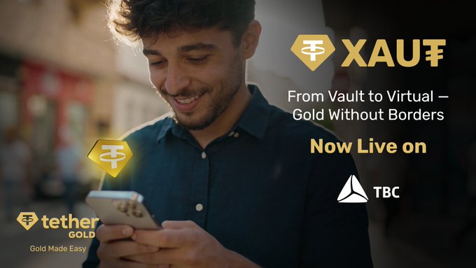 The image features a man smiling while looking at his cell phone, which has "XAU" written on it. The background of the image shows a city street with buildings visible behind him. There are also other people present in the scene, but they are not the main focus of the image. The post about Tether Gold is displayed prominently and includes text that reads: "From Vault to Virtual - Gold Without Borders Now Live on TBC Bank".
