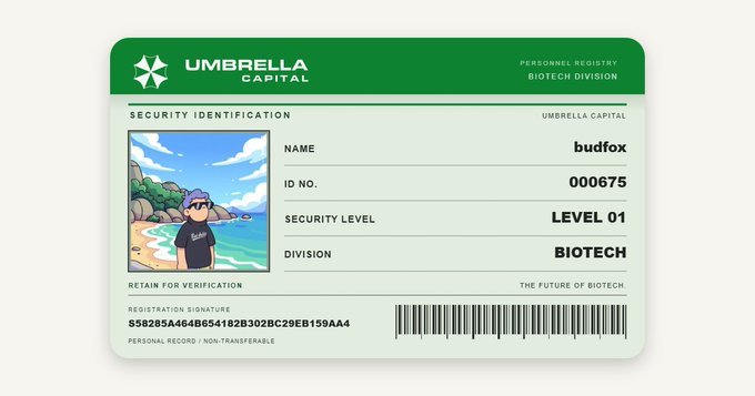 A green Umbrella Capital personnel ID badge for 'budfox', ID No. 000675, with Security Level 01 in the Biotech Division, featuring an anime-style character photo and a barcode.
