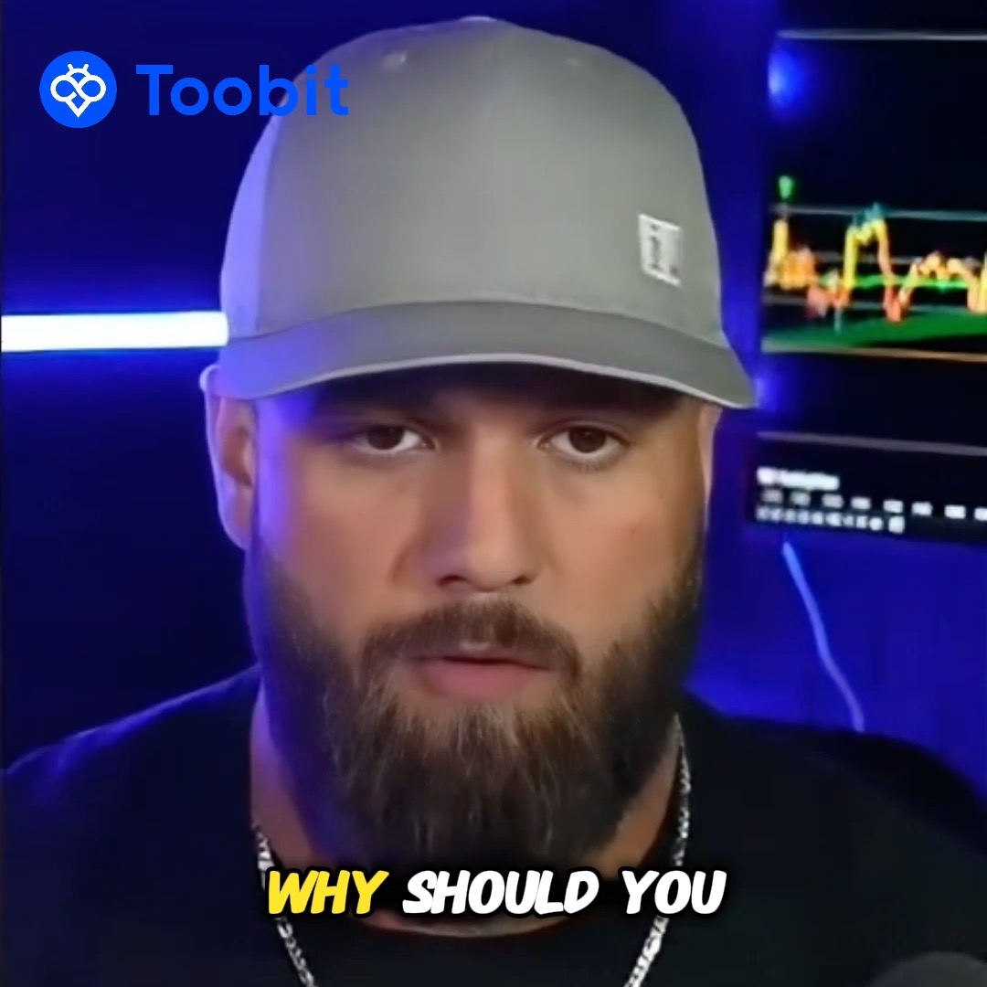 A close-up of a man with a beard wearing a cap, with a 'Toobit' logo in the corner and yellow and white text reading 'WHY SHOULD YOU'.