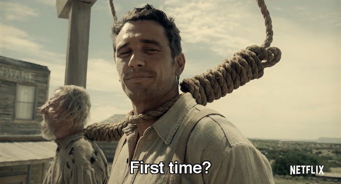 Two cowboys are shown hanging from nooses with the subtitle "First time?" and the Netflix logo visible, fitting the meme's joke about seasoned crypto veterans' weary reaction to newcomers (AI bros) explaining regulatory capture—implying it's painfully obvious to those who've witnessed it for years.