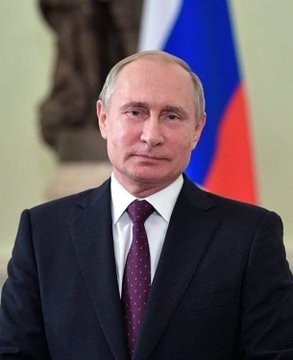 In this image, Russian President Vladimir Putin stands beside the Russian flag, as his country's new "Digital Currencies and Digital Rights" law, which allows retail investors to purchase up to ₽300,000 ($3,700) of crypto annually, including Bitcoin, Ethereum, and USDT, takes effect.