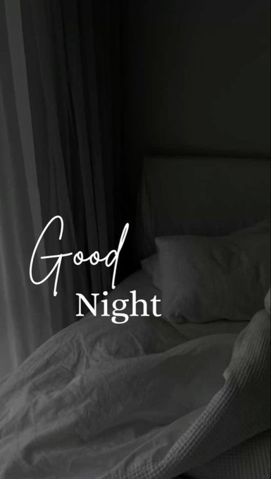 A dimly lit bedroom with an unmade bed and dark curtains features elegant white script reading "Good Night," conveying a peaceful end to the day that complements the post's reflective "goodnight…" sign-off.