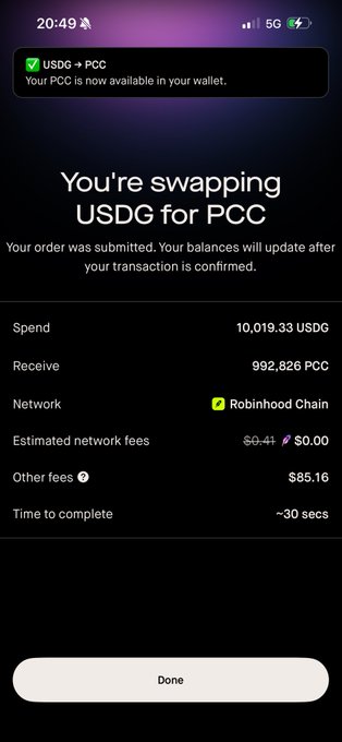 A mobile screen showing a cryptocurrency swap confirmation: 'You're swapping USDG for PCC', spending 10,019.33 USDG to receive 992,826 PCC via Robinhood Chain, with $85.16 in other fees.