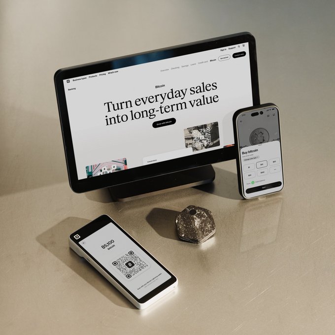 A tablet, smartphone, and mobile point-of-sale device display the Bitcoin POS interface, featuring a homepage that reads "Turn everyday sales into long-term value" alongside a QR code for $5,000 and a customer checkout screen—visually reinforcing how Bitcoin is being integrated into everyday retail transactions through sleek, minimalist design.