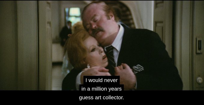 A scene from the film 'The Grand Budapest Hotel' showing M. Gustave embracing Madame D., with subtitles reading, 'I would never in a million years guess art collector.'
