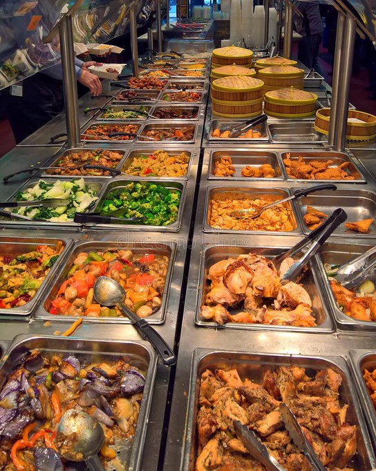 A wide array of steaming dishes fills a Chinese buffet's serving station, with metal trays holding chicken, vegetables, eggplant, and steamed buns visible to customers selecting their meals. The image visually represents the post's analogy comparing an all-you-can-eat Chinese buffet—where a fixed $19.99 fee grants unlimited access to varied dishes—to how Strategy and Strive are offering digital credit access to Bitcoin.