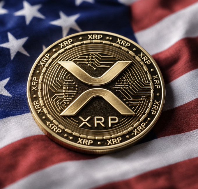 A gold XRP cryptocurrency coin resting on an American flag, featuring the distinctive XRP logo and 'XRP' text repeated around its edge.