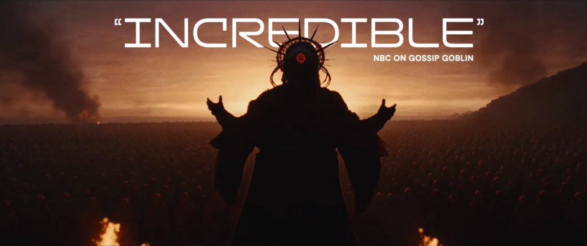 A dark, robed figure with a spiked crown stands with arms outstretched before a vast crowd under an ominous orange sky, with the bold text "INCREDIBLE" and "NBC ON GOSSIP GOBLIN" overlaid—evoking the apocalyptic grandeur of a fully AI-generated film debuting in theaters.