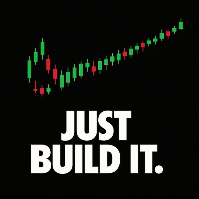 Motivational graphic with a black background displaying a green and red candlestick stock chart showing an upward trend, accompanied by the bold white text 'JUST BUILD IT.'