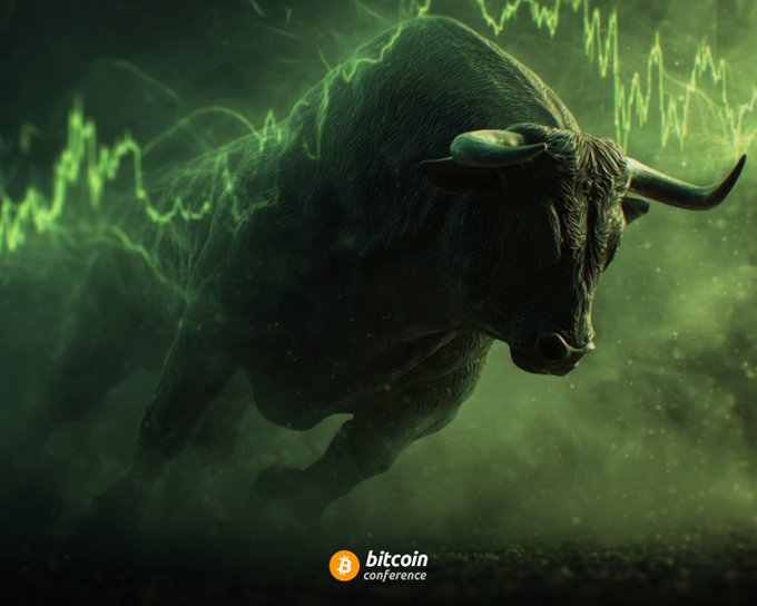 A stylized digital illustration of a charging bull with green stock market chart lines in the background, and the 'bitcoin conference' logo at the bottom.