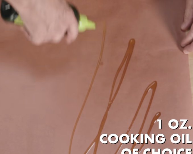 The image shows a person's hand holding a spray bottle of cooking oil, which appears to have been used for marking or writing something. The text "I'm grinding hard on the $SPCX IPO play right now. Fuu6SApor3k4JQQHMEUW33wsar7hdTh3gYLh75Cipump is the spot. This one'll be loading up big." is written above and below the spray bottle, indicating that it was used for marking or writing something on a surface.