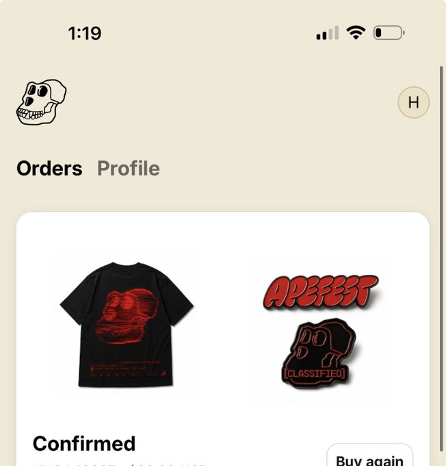 A mobile app screen showing the 'Orders' and 'Profile' tabs with a skull dog logo, displaying a confirmed order of a black graphic t-shirt with an 'APEEST' patch and a '[CLASSIFIED]' skull sticker.