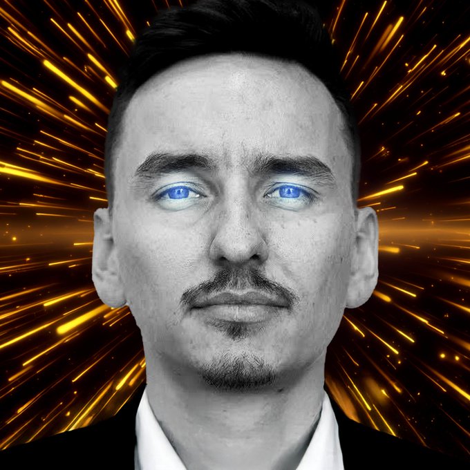 A black-and-white portrait of a man with striking glowing blue eyes and a small mustache and goatee, set against a dynamic background of radiating orange and yellow light streaks that suggest energy or explosion. The intense, otherworldly gaze visually reinforces the post's optimistic sentiment about $ADA's breakout and expansion toward $0.48, symbolizing the cryptocurrency "waking up."