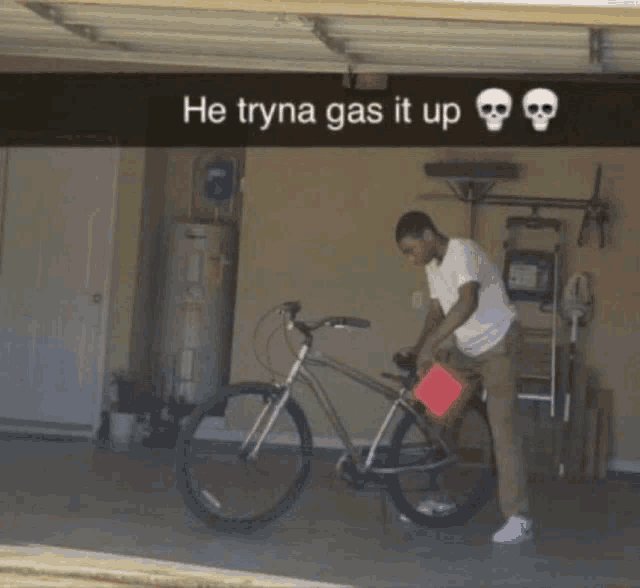 A meme showing a man working on a bicycle in a garage, with the caption 'He tryna gas it up 💀💀' and a red square censoring part of the image.