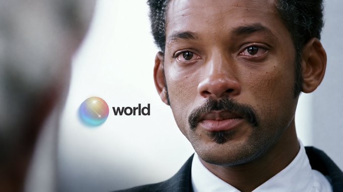 A close-up of Will Smith's face looking serious, with a small 'world' logo visible on the left side of the frame.