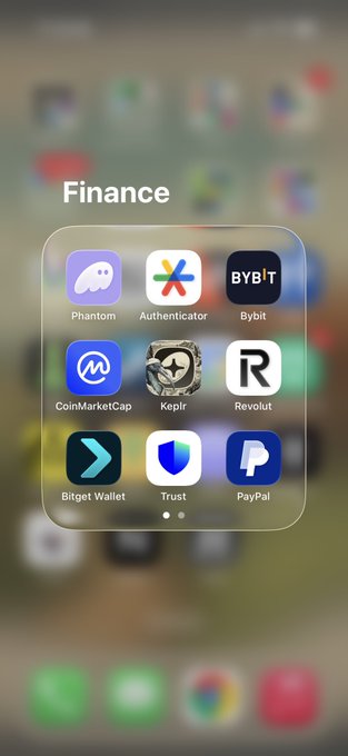 iOS Finance folder displaying app icons including Phantom, Authenticator, Bybit, CoinMarketCap, Keplr, Revolut, Bitget Wallet, Trust, and PayPal.
