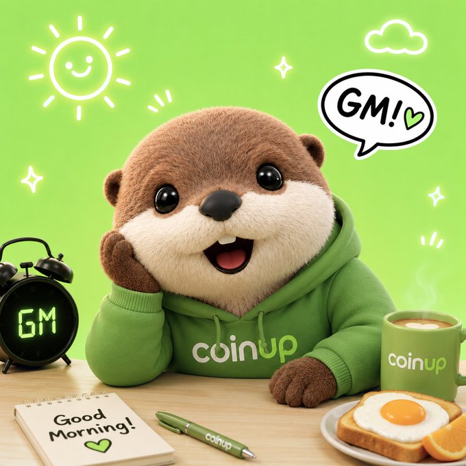 A cheerful 3D-rendered otter mascot wearing a green "coinup" hoodie, saying "GM!" (Good Morning) with a notepad reading "Good Morning!", alongside a "GM" alarm clock, coffee mug, and breakfast.