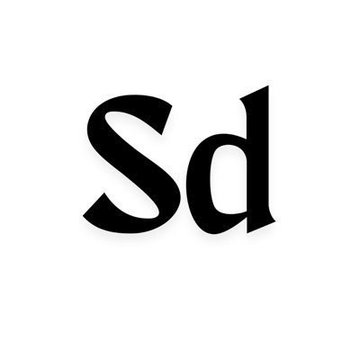 The image features a black and white logo with the word "SD" written in all capital letters, positioned centrally against a white background. The text appears to be part of a larger social media platform or website, as indicated by the accompanying caption that reads "@solana @STONEGODSHQ @misfitsorder @wonderbossnft".