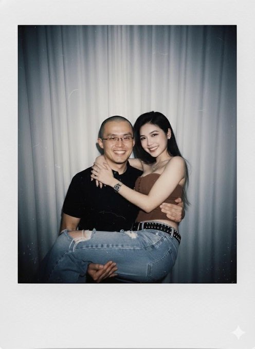 A polaroid-style photo shows a smiling man holding a woman in a brown top and jeans as she wraps her arms around him.