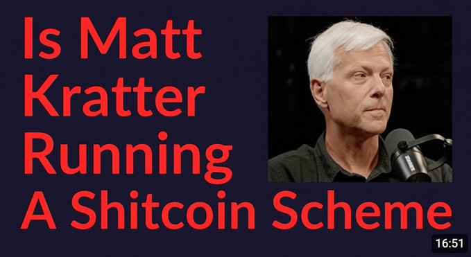 A YouTube thumbnail featuring a dark navy background with bold red text reading "Is Matt Kratter Running A Shitcoin Scheme" alongside a photo of Kratter speaking into a Shure microphone. The video length of 16:51 is displayed, and the image directly references Kratter's cryptocurrency content, tying to the post's criticism of his $79/month "Bitcoin University" course.
