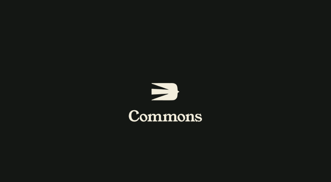 The image shows a black screen with the white British Rail "double arrow" logo above the word "Commons" in serif text. As an accompanying visual for the caption "This is when everything really starts. The flywheel," it symbolizes the beginning of momentum—using the iconic railway emblem to represent the launch or starting point of an ongoing journey.