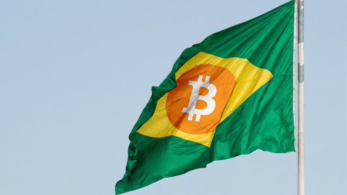 The national flag of Brazil, featuring its iconic green field, yellow diamond, and blue globe, digitally altered to have the Bitcoin 'B' symbol instead of the traditional starry globe.