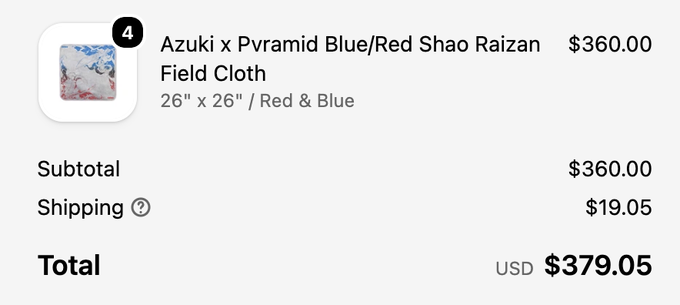 An order summary showing 4 Azuki x Pvramid Blue/Red Shao Raizan Field Cloths at 26" x 26" for $360.00, with $19.05 shipping bringing the total to $379.05 USD—reflecting the new Azuki x Pvramid playmat restock mentioned in the post.