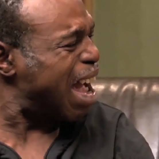 An older man with a gray beard is shown in a close-up, wailing with his eyes shut and mouth wide open in visible distress. The image humorously illustrates the post's lamentation about holding $CET, capturing the emotional "crying and moaning" the author describes.