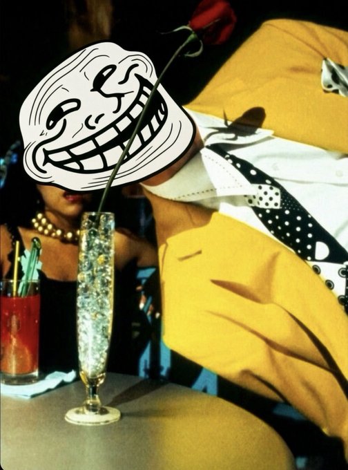 A trollface meme is overlaid on a scene featuring a person in a yellow jacket with a polka-dot tie leaning toward a champagne flute with a rose, alongside a woman wearing a pearl necklace.