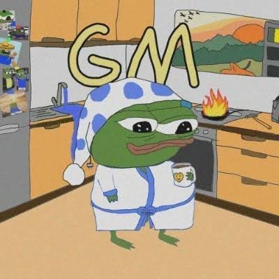 A cartoon Pepe the Frog character wearing a blue and white polka dot nightcap and robe, standing in a kitchen with "GM" text overlaid at the top.
