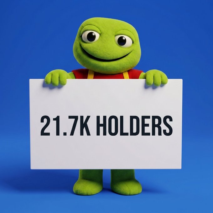 A green frog mascot wearing red and yellow holds a white sign reading "21.7K HOLDERS" against a blue background, celebrating the growing community of $TOAD token holders.