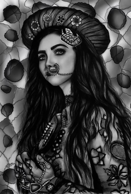 A detailed black-and-white pencil drawing of a woman with long flowing hair, wearing an ornate headdress with flowers and a jeweled nose ring, surrounded by decorative floral and stone patterns.