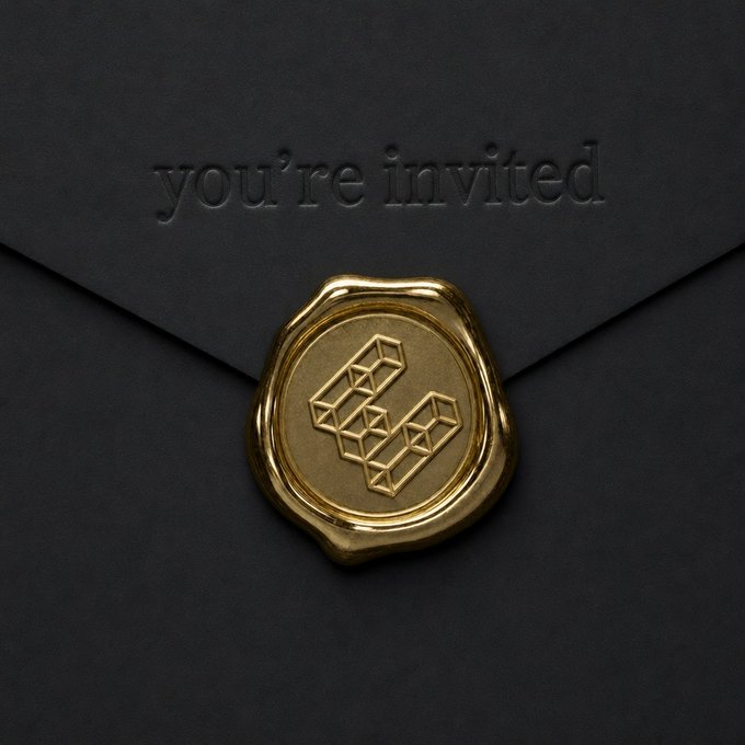 A black envelope sealed with a gold wax seal featuring a geometric 'F' logo, with 'you're invited' embossed on the envelope flap.