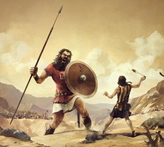 The image depicts the biblical scene of David and Goliath, with the giant Goliath wielding a spear and shield while the smaller David prepares to sling a stone—mirroring the "launchpad wars" post through the visual metaphor of startup founders (David) taking on industry giants (Goliath) using unconventional tactics.
