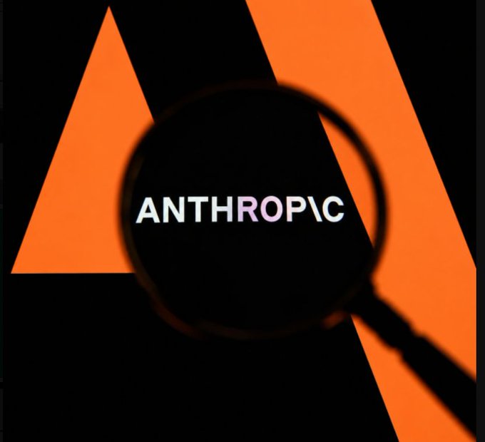 Stylized image of the Anthropic logo viewed through a magnifying glass against an orange and black geometric background.