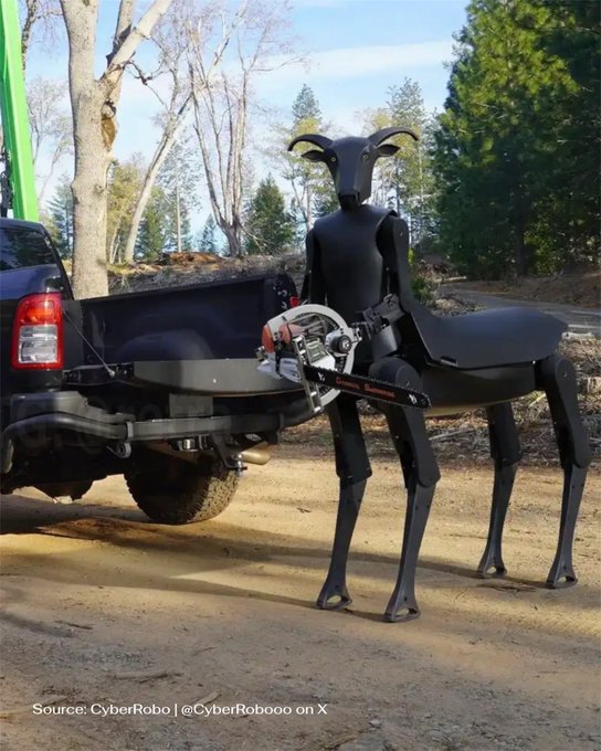 A large black robotic dog stands outdoors holding a chainsaw in its mouth, credited to CyberRobo (@CyberRoboo on X), with a pickup truck parked in the background.