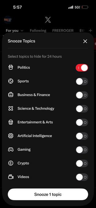 A mobile screenshot of X (Twitter) showing the 'Snooze Topics' menu, with the Politics toggle switched on (snoozed) and other topics like Sports, Business & Finance, and Crypto turned off.