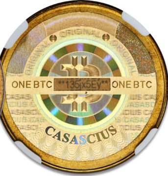 A close-up image of a physical Casascius Bitcoin coin, gold-toned with a holographic center displaying the Bitcoin logo and the text "ONE BTC," "135ix5Ey" (serial number), and "CASASCIUS," illustrating a tangible collectible whose private keys were originally held by the creator. The coin relates to the post's point about early physical Bitcoin items carrying security risks, since Casascius and BitBill manufacturers initially possessed the private keys upon generation.