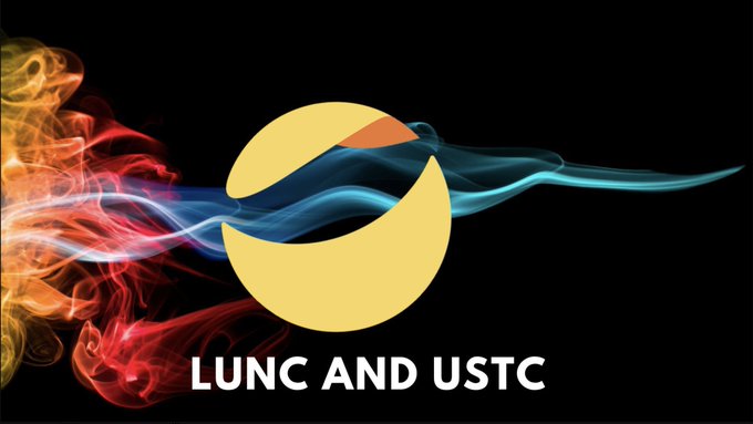 A yellow circular logo with an orange segment appears against a black background, framed by swirling red and blue smoke-like wisps, with the text "LUNC AND USTC" displayed below in bold white letters. The graphic visually reinforces the post's excitement about Terra Classic's decentralized potential by featuring stylized, dynamic imagery of the two highlighted altcoins.