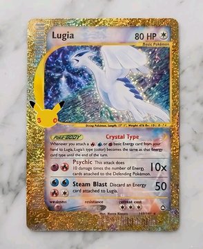 A holographic Pokémon trading card featuring the character 'Lugia' at the top, with attacks listed as 'Crystal Type' and 'Steam Blast', set against a dark background.
