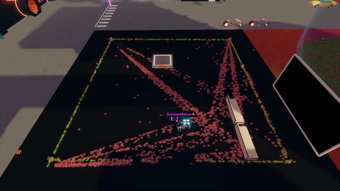 A screenshot from a video game featuring a black rectangular area with a grid of pink dots and yellow border lines, containing a small avatar labeled 'BrandonMunoz' near a brown rectangular object.