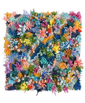 A vibrant, textured coral reef artwork or textile piece featuring densely packed colorful coral formations in blues, oranges, pinks, and greens.