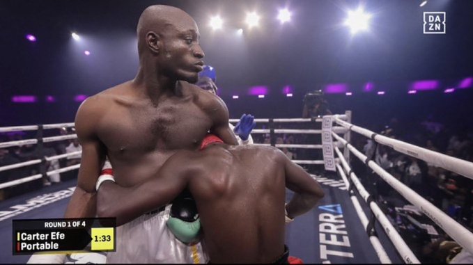A DAZN broadcast of a boxing match in round 1 showing two fighters, 'Carter Efe' and 'Portable', embracing or clinching in the ring with 1:33 remaining.