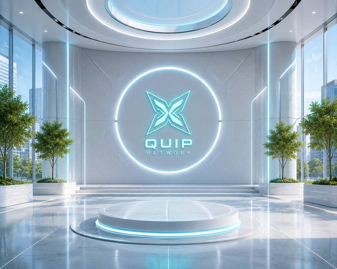 A futuristic, sleek white interior space with a glowing circular display showing a blue star-like logo and the text 'QUIP NETWORK', flanked by green trees and large windows.