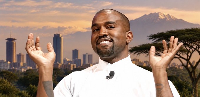 Kanye West stands smiling with both hands raised, wearing a white shirt with a lapel microphone, against a backdrop of a city skyline and Mount Kilimanjaro.