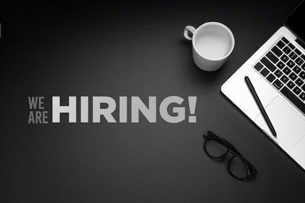 A flat-lay workspace photo with a laptop, coffee mug, glasses, and pen displays the bold text "WE ARE HIRING!" — suggesting that the Chroma Souls NFT community is actively recruiting new team members to help build out their long-term vision.