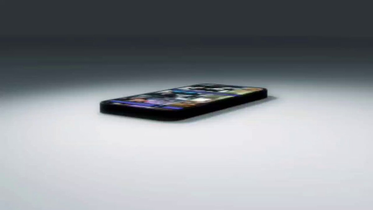 The image features an upside-down cell phone with a colorful design on its back. The phone is placed on a white surface against a gray background. The text "the lore behind the @degentokenbase name, mascot top hat" can be seen in the image, which suggests that this might be related to a popular culture phenomenon or a meme. The post also mentions that the phone's design was created by @jacek0x and is named after the character @jacek0x from the movie "@jacek0x".