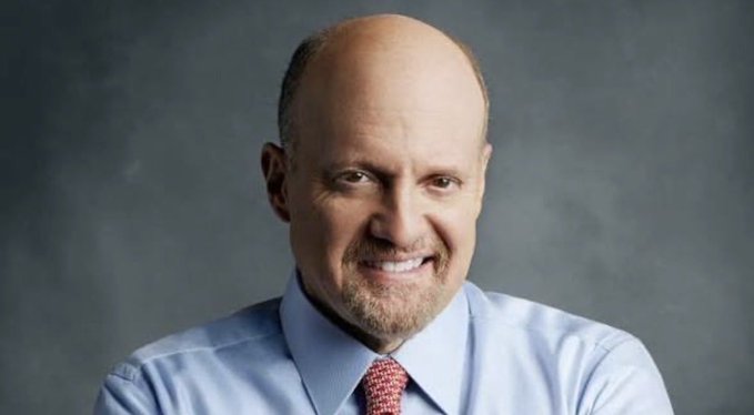 The image features a bald man wearing a blue shirt, red tie, and smiling at the camera. The caption reads "Just In: Jim Cramer says live on CNBC this morning that Saylor murdered Bitcoin." This statement suggests that there was an event or news related to Bitcoin in which Saylor, a well-known figure, played a significant role. The man's smile indicates that he is happy about the topic being discussed by the famous financial expert.