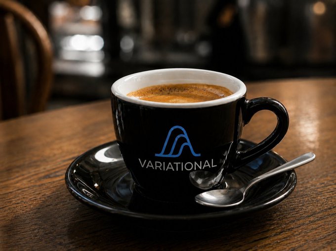 A small black espresso cup filled with coffee sits on a black saucer on a wooden table, featuring a blue logo and the text 'VARIATIONAL'.